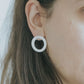 A silver moon and its porcelain orbit - two earrings in one