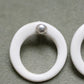 A silver moon and its porcelain orbit - two earrings in one