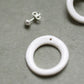 A silver moon and its porcelain orbit - two earrings in one