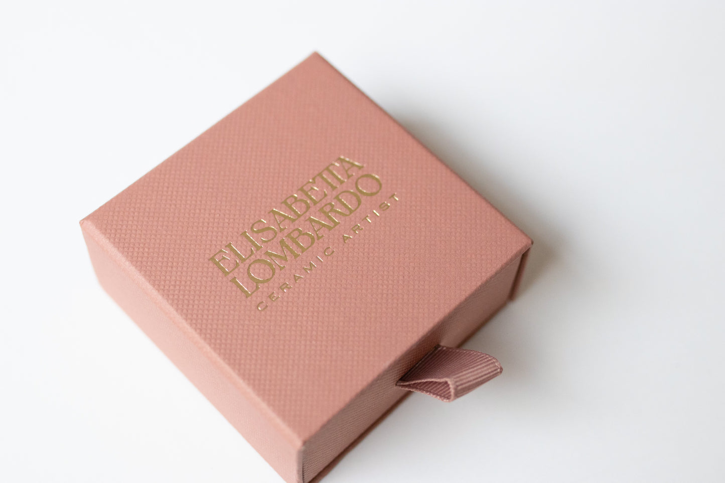 A silver moon and its porcelain orbit - two earrings in one